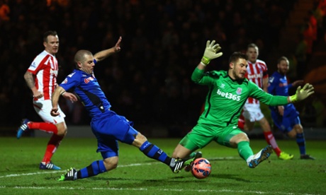 Jack Butland blocks an effort from Stephen Dawson as Rochdale begin to threaten.