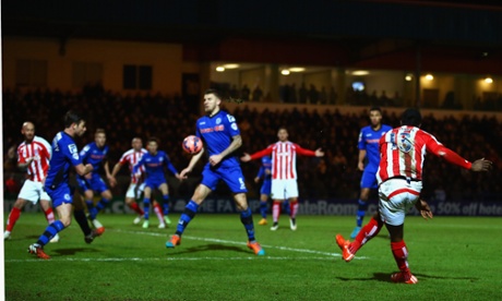 Victor Moses of Stoke City curls the ball into the top corner of the net, game over for Rochdale.