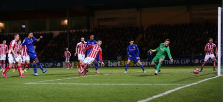 Rhys Bennett of Rochdale slots the ball home, a consolation.