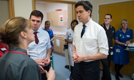 Ed Miliband (centre) and shadow health secretary Andy Burnham (second left) meeting staff and patients at the George Eliot Hospital in Nuneaton yesterday.