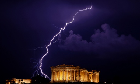A flash of lightning illuminates the sky over  the Parthenon temple in Athens