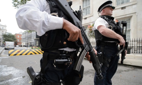 Armed police officers outside Downing Street, London, after the UK's terror threat risk level was raised to 