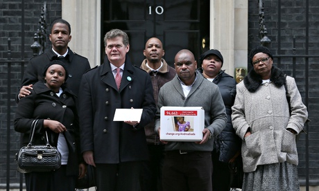 Supporters of the Gada family, and Stephen Lloyd MP hand in their petition on Tuesday.