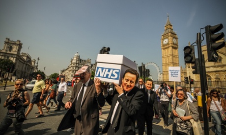Members of the National Health Action party protest against the gradual privatisation of the NHS, in 2013.