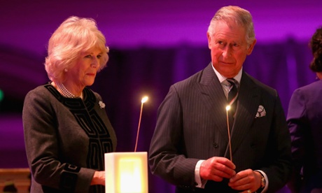 The Prince of Wales and Duchess of Cornwall take part in a candle lighting ceremony on stage at Westminster.