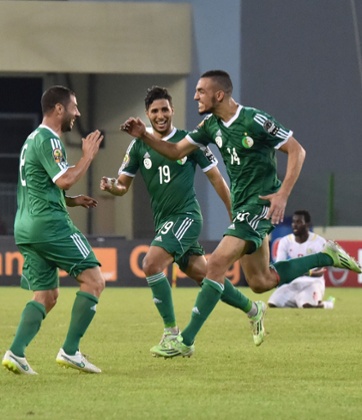 Algeria's midfielder Nabil Bentaleb, right, celebrates after scoring
