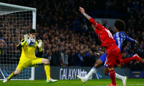 Strong hands from Chelsea's Thibaut Courtois forces  a shot from Liverpool's Alberto Moreno away from danger.