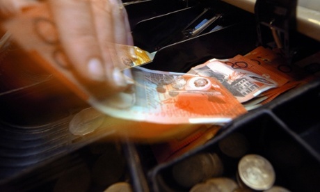 Money being removed from a till in Canberra