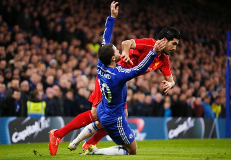 Liverpool's Emre Can enters the ref's book thanks to this obstruction.