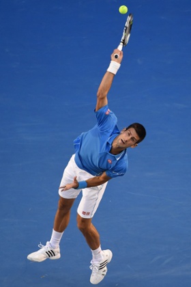 Djokovic serves.