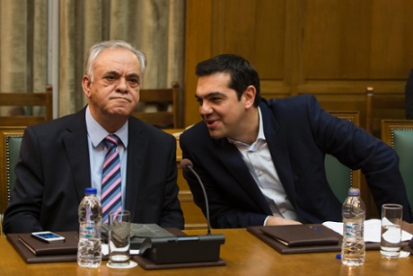 Greek Prime Minister Alexis Tsipras (R) talks to Deputy Prime Minister Yannis Dragasakis during the first meeting of new cabinet post elections in the parliament building in Athens January 28, 2015.