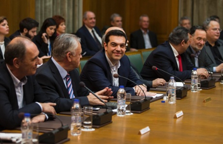 Greek Prime Minister Alexis Tsipras (3rd L) smiles during the first meeting of new cabinet post elections in the parliament building in Athens January 28, 2015.