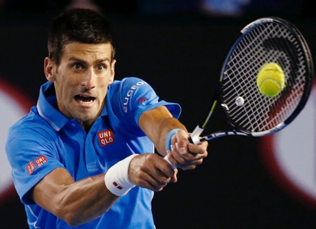 Novak Djokovic smashes a return.