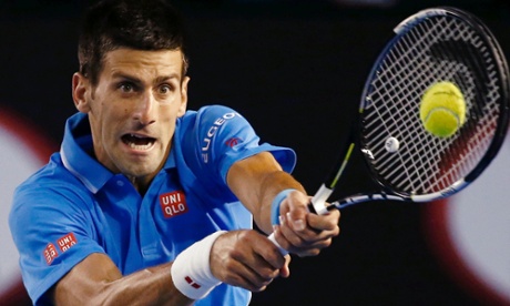 Novak Djokovic smashes a return.
