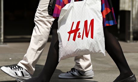 A shopper with an H&M bag on Oxford Street, London