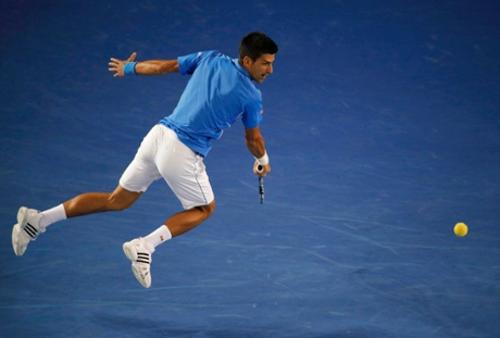 Novak Djokovic jumps to hit a return.