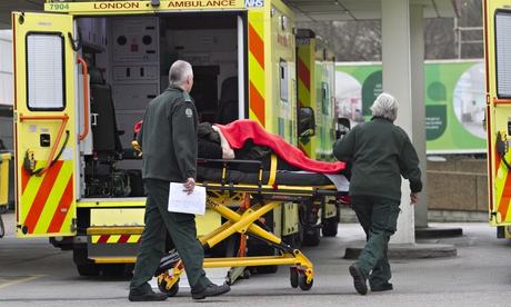 A patient on a trolley with A&E staff at St Thomas's hospital in London