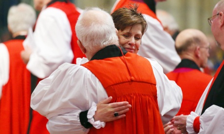 Bishop Libby Lane hugs a member of the clergy during her consecration at York Minster 