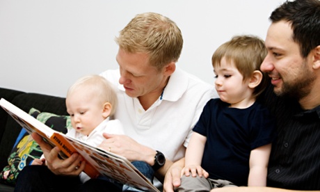 Fathers reading a book to their children Sweden.