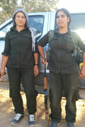 Ruhan Hassan, right, with a fellow fighter.