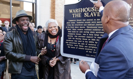Bryan Stevenson (right) with 12 Years a Slave actor Chris Chalk and Black Heritage council chair Frazine Taylor at the 2013 unveiling of a hard-won slave trade historical marker in Montgomery.