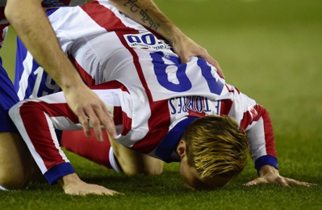 Torres kisses the turf ...