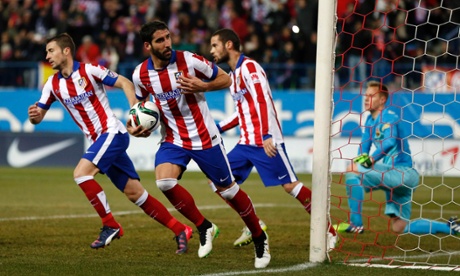 Multi-tasking from Atletico Madrid’s Raul Garcia as he celebrates his impeccable penalty whilst running the ball back to the centre circle.