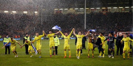 The Tottenham players celebrate their victory.