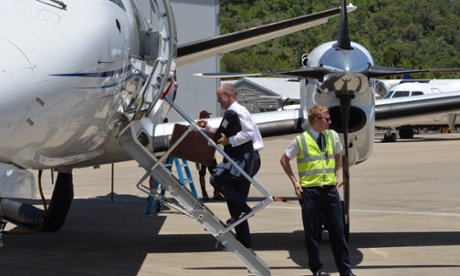 Queensland Premier Campbell Newman boards a plane at Cairns International Airport during his campaign for re-election on Thursday.