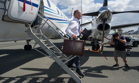 Queensland Premier Campbell Newman arrives back from Cairns in Brisbane on Thursday.
