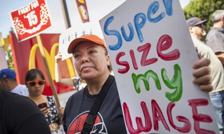 Protestors rally and close down a McDonalds restaurant in downtown Oakland as hundreds of fast-food workers throughout the city join in on a worldwide campaign for higher pay and the right to form a union.