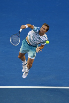 Tomas Berdych serves.