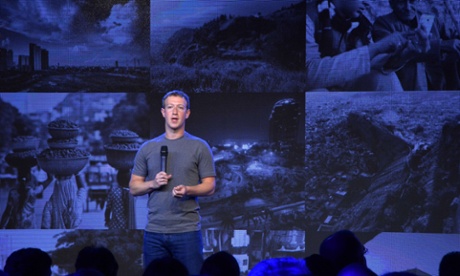 Mark Zuckerberg holds a microphone at a briefing