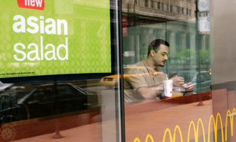 A customer has a meal at a McDonald's restaurant in downtown Chicago.