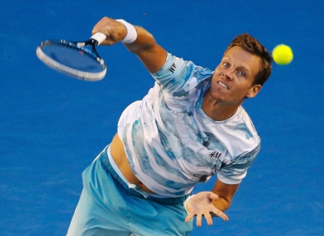 Tomas Berdych serves.