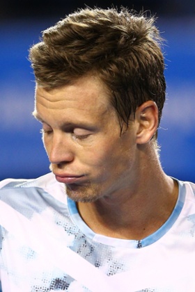 Berdych looks on.