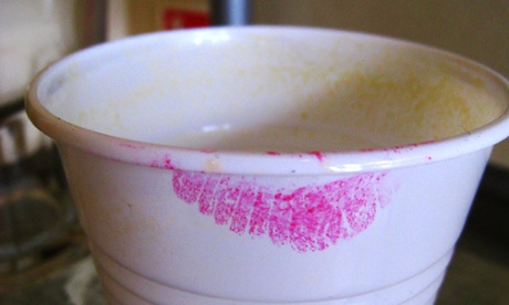 Lipstick mark on abandoned plastic coffee cup