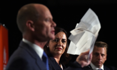 Queensland Premier Campbell Newman waves papers which he says contain Labor's election costings during a Leaders debate with and Opposition leader Annastacia Palaszczuk (centre) in Brisbane on Friday.