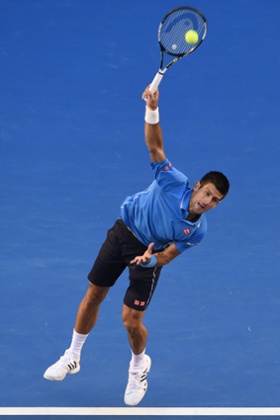 Djokovic serves.