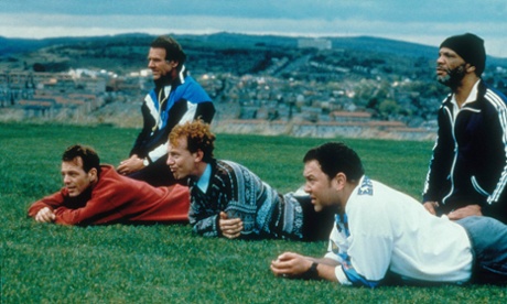 A scene from The Full Monty with Sheffield in the background.