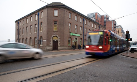 The ‘Supertram’ rumbles past West Street job centre in Sheffield.