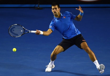 Djokovic hits a return.