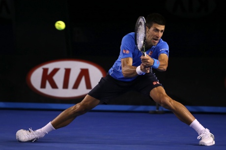 Djokovic plays a backhand.