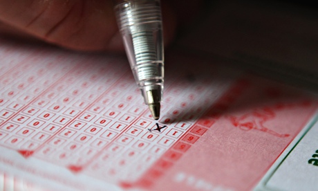 A man fills out a betting slip