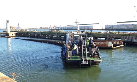 LCT 7074 being brought to surface after sinking in Liverpool docks.