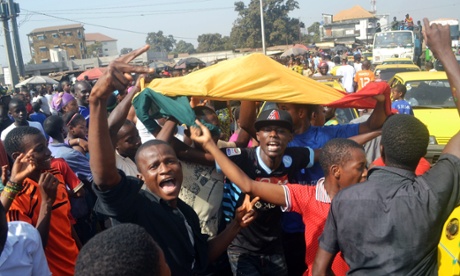 Guineans celebrate in Conakry after Guinea qualified for the Africa Cup of Nations quarter-finals.