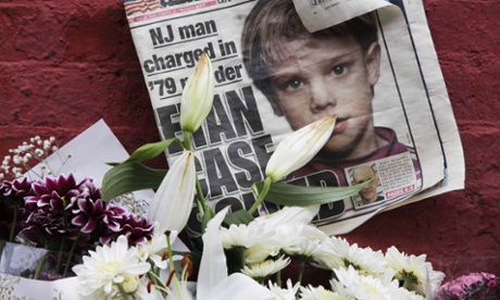 FILE - This May 28, 2012, file photo shows a newspaper with a photograph of Etan Patz at a makeshift memorial in the SoHo neighborhood of New York where Patz lived before his disappearance on May 25, 1979. The memorial was set up near a building that housed a convenience store where Pedro Hernandez, accused of killing Patz, told police 33 years after they boy's disappearance, that he choked the 6-year-old and put the still-living boy into a plastic bag, boxed up the bag and left it on a street. Opening statements in Hernandez's trial are set for Friday, Jan. 30, 2015. (AP Photo/Mark Lennihan, File)