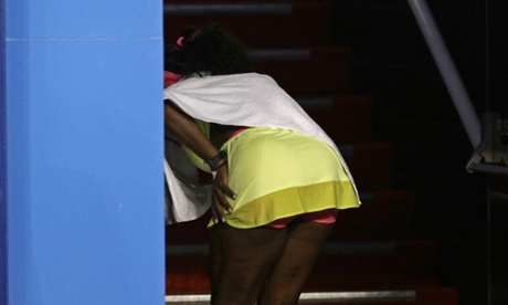 Serena Williams is clearly unwell as she coughs during the rain delay.