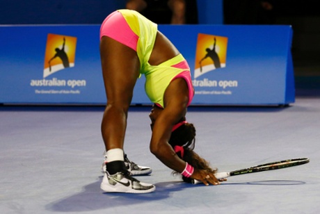 Serena Williams reacts after hitting a return to Maria Sharapova who is battling hard to stay in the match.