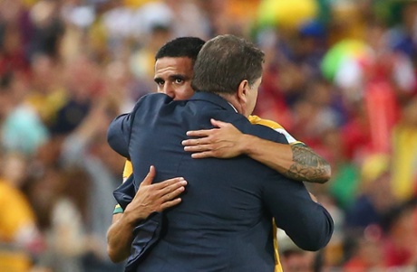 Australian coach Ange Postecoglou hugs Tim Cahill after his substitution.